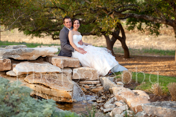 Bride and groom near pond