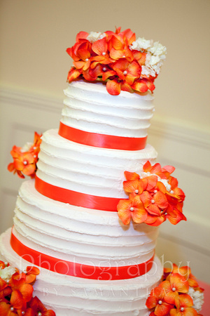 Wedding Cake with peach flowers and ribbon