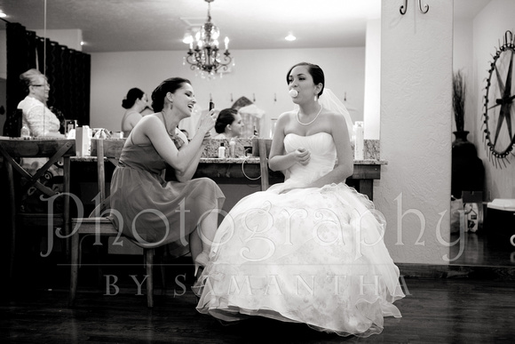 Bride blowing a bubble before wedding